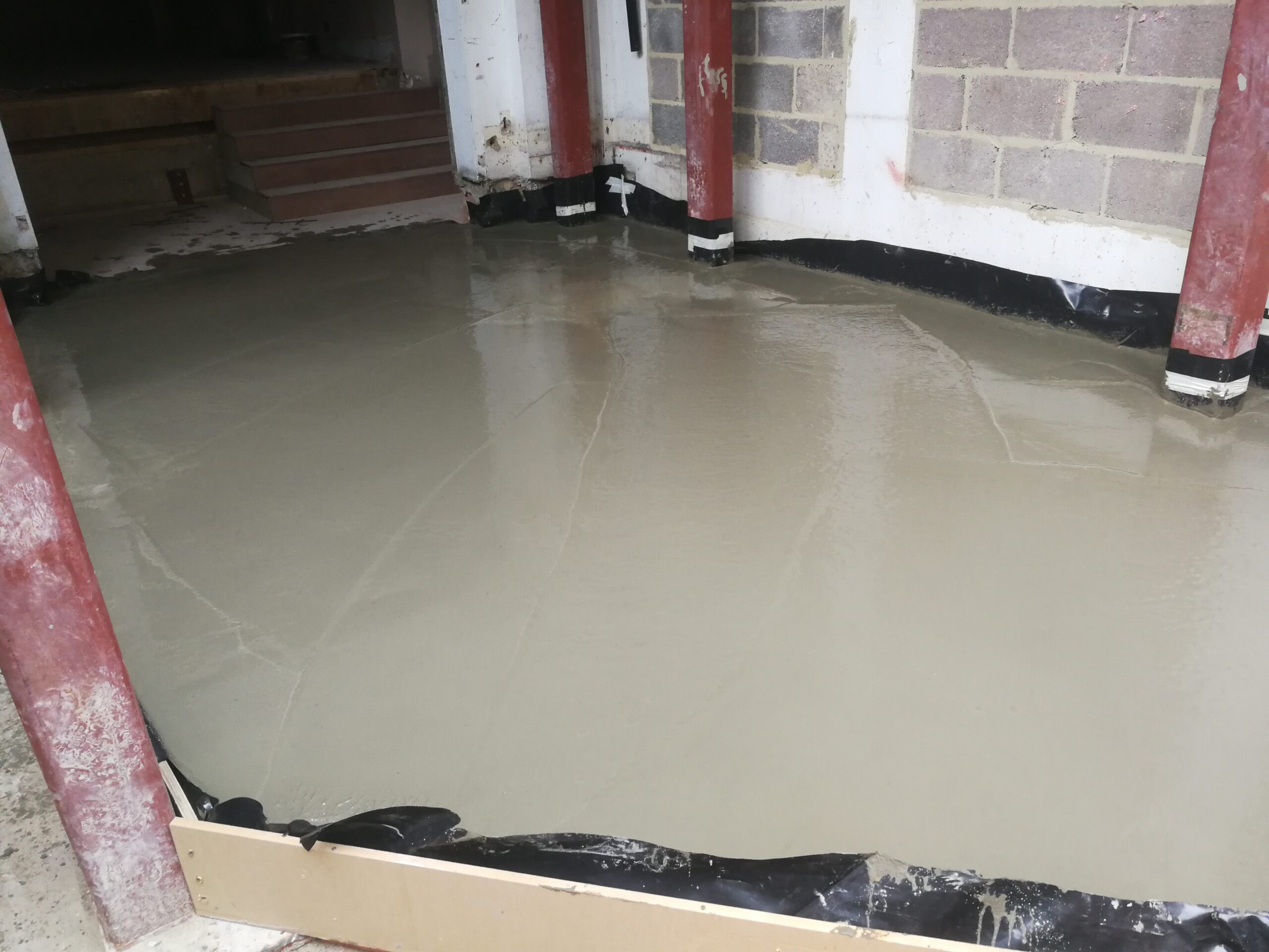 36–38 Queensway – newly poured concrete screed forming part of the extension floor structure